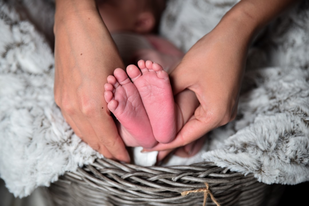 Photo by Eric Froehling person holding baby's feet